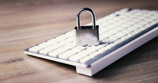 Your-2025-Privacy-Compliance-Checklist-and-What-You-Need-to-Know-About-the-New-Data-Laws-scaled.jpg a computer keyboard with a padlock on top of it