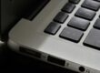 Free Detailed view of a silver laptop showing keyboard and multiple ports. Stock Photo