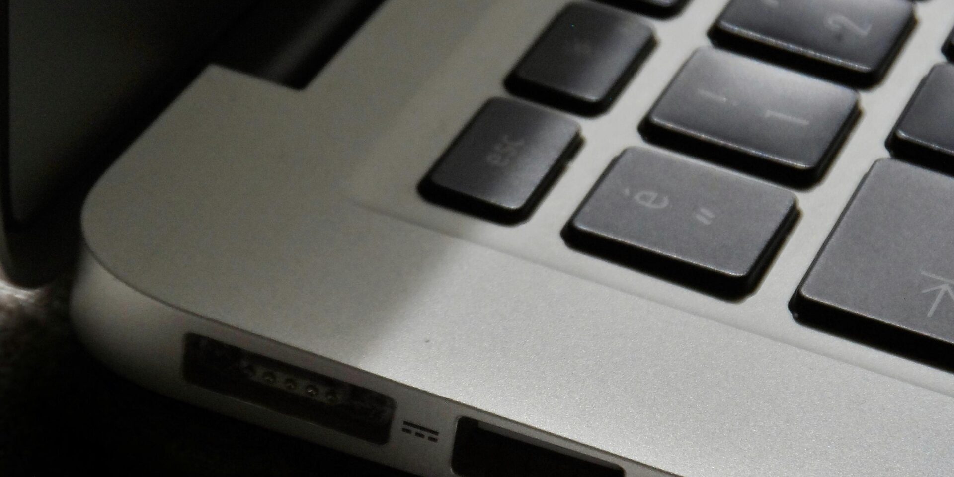 The-Zombie-SaaS-Audit_-Finding-the-3-Apps-Your-Former-Employees-Still-Access-scaled.jpg Free Detailed view of a silver laptop showing keyboard and multiple ports. Stock Photo
